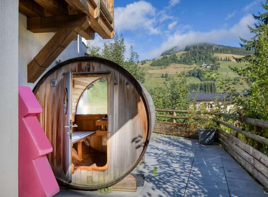 Experience ultimate relaxation in this unique barrel sauna, a perfect addition to any luxury property.