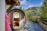 Experience ultimate relaxation in this unique barrel sauna, a perfect addition to any luxury property.