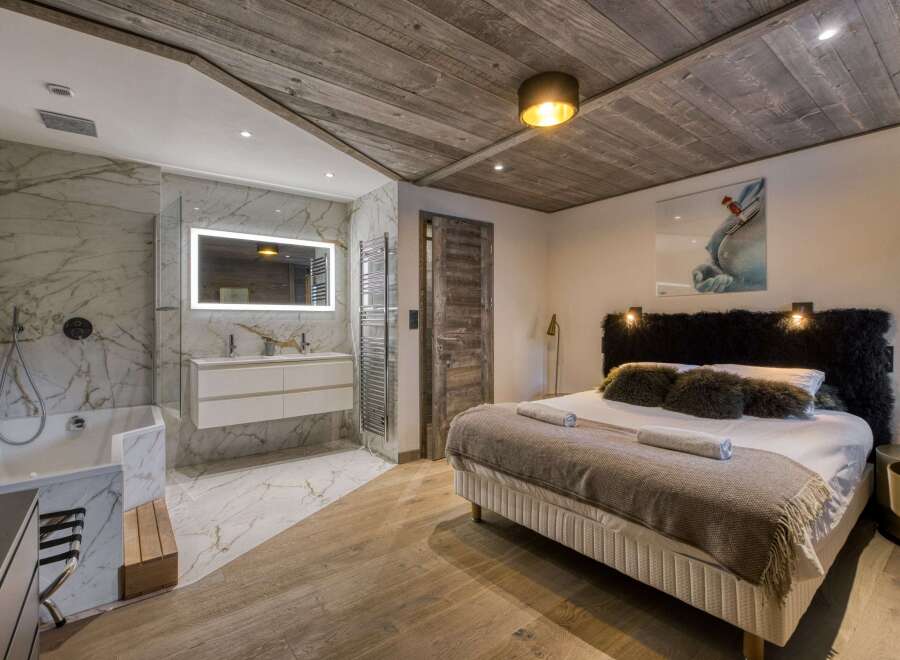 Experience luxury in this stunning bedroom and bathroom.