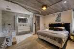 Experience luxury in this stunning bedroom and bathroom.