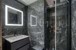 Step into luxury with this stunning bathroom featuring sleek, modern design.