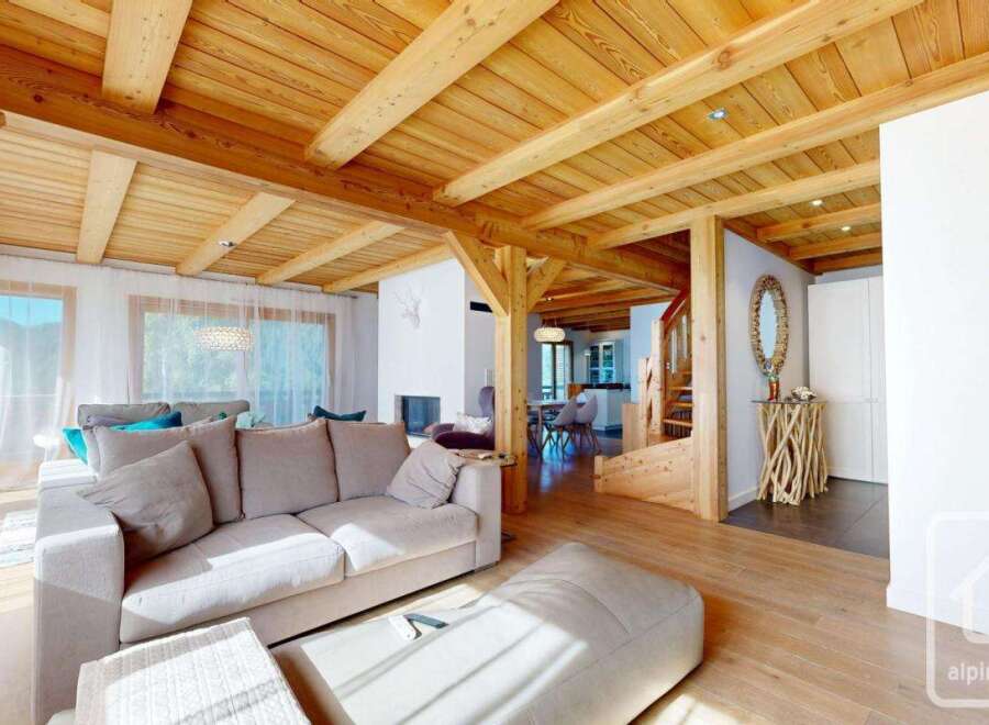 Experience the warmth of this stunning property, featuring a beautifully crafted wooden ceiling and inviting living spaces.