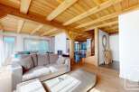 Experience the warmth of this stunning property, featuring a beautifully crafted wooden ceiling and inviting living spaces.