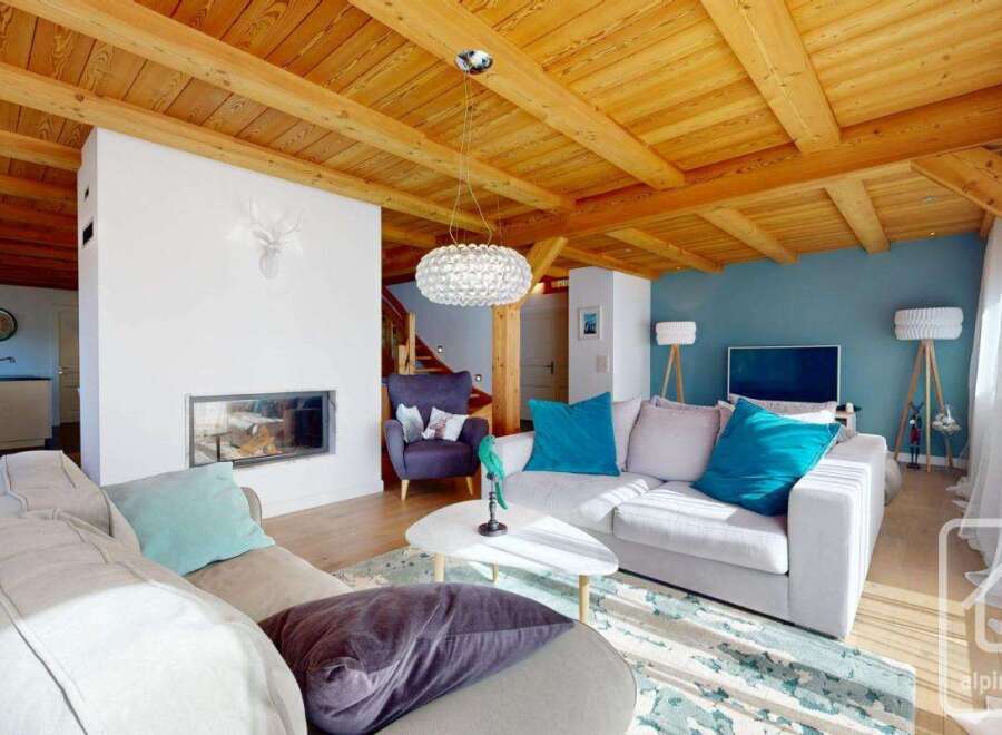 Experience luxury living in this stunning property, featuring a cozy fireplace and a modern, open-plan design.