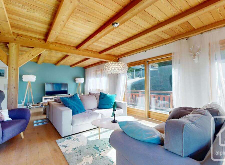 Experience the charm of this stunning property, featuring a beautifully designed living room with a cozy ambiance.