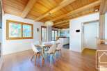 Experience the charm of this stunning property, featuring a beautifully designed dining area with a modern table and chairs.