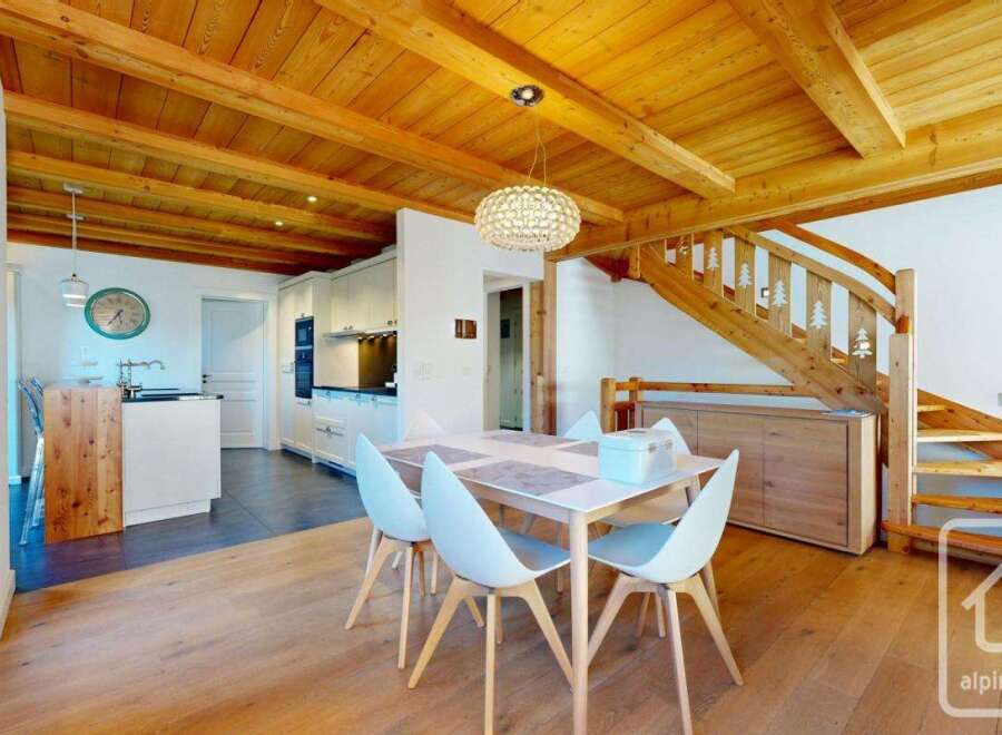 Discover the charm of this stunning property, featuring a beautifully designed interior with wooden beams and a modern kitchen.