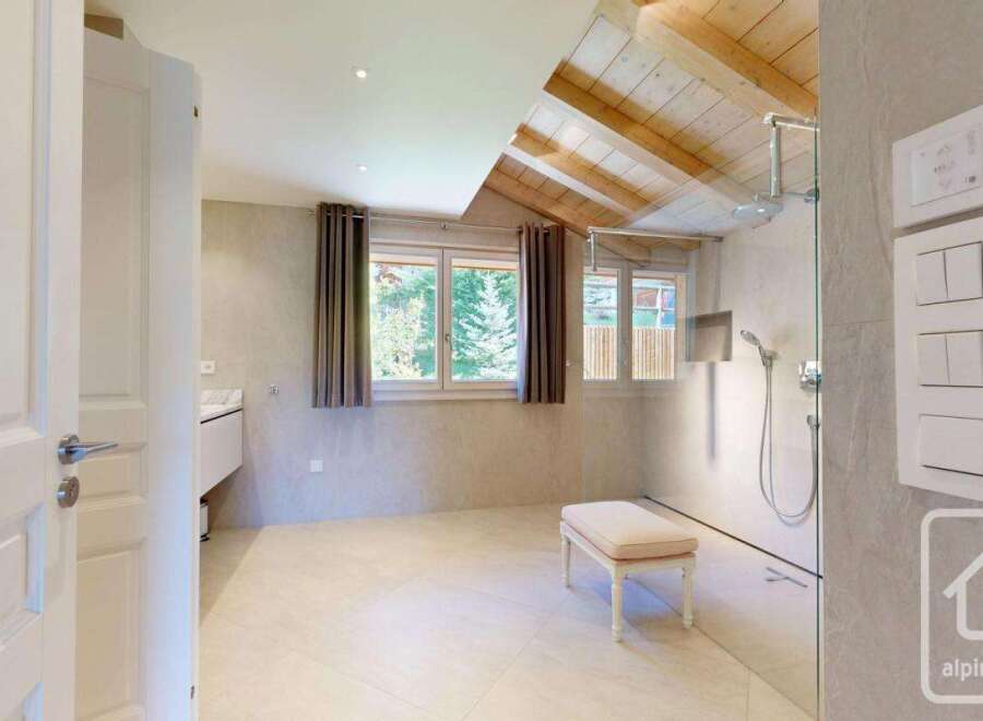 This luxurious bathroom boasts a modern design with a touch of rustic charm.