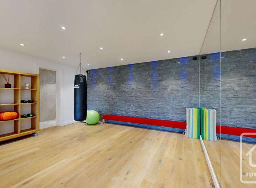 This modern gym space features a sleek design with a focus on functionality and style.