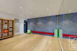 This modern gym space features a sleek design with a focus on functionality and style.