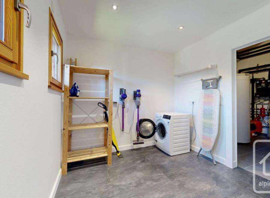 Discover the convenience of this well-equipped utility room, perfect for managing household chores.