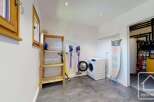 Discover the convenience of this well-equipped utility room, perfect for managing household chores.
