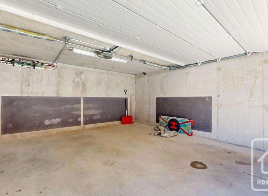 This spacious garage offers ample storage and parking space.