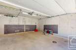 This spacious garage offers ample storage and parking space.
