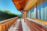 Experience the charm of this stunning property with its inviting wooden balcony and breathtaking mountain views.