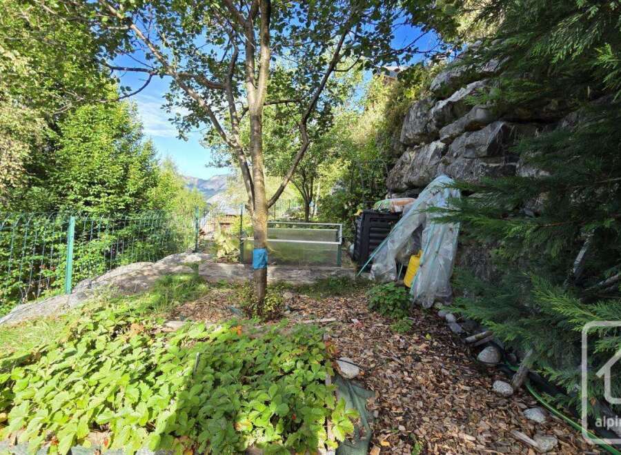 Discover a charming property surrounded by lush greenery and natural beauty.