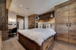 Experience rustic elegance in this stunning bedroom.