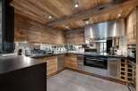 This stunning kitchen boasts a rustic yet modern design, perfect for any home.