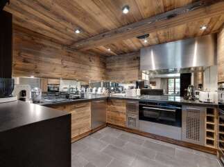 This stunning kitchen boasts a rustic yet modern design, perfect for any home.
