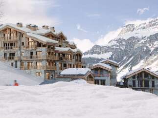 Experience luxury living in this stunning mountain chalet, nestled in a picturesque winter wonderland.