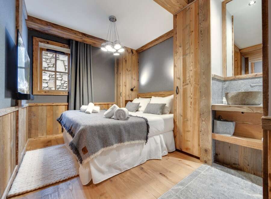 Experience rustic elegance in this stunning bedroom.