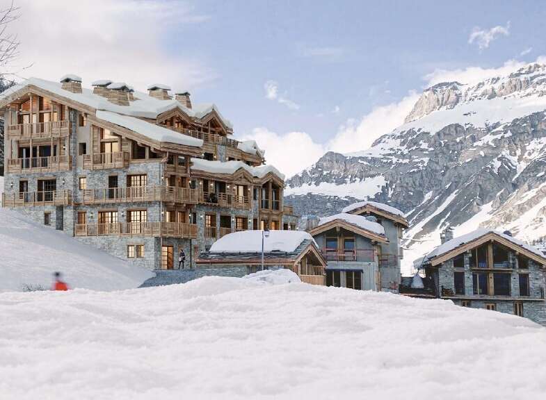 Experience luxury living in this stunning mountain chalet, nestled in a picturesque winter wonderland.