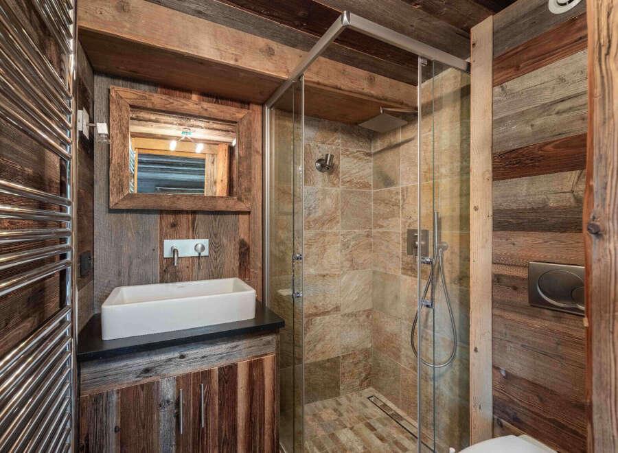Step into rustic elegance with this stunning bathroom.