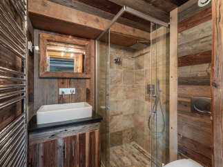 Step into rustic elegance with this stunning bathroom.