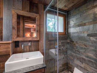 Experience rustic elegance in this stunning bathroom.