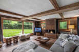 Experience the ultimate in rustic luxury with this stunning living room.