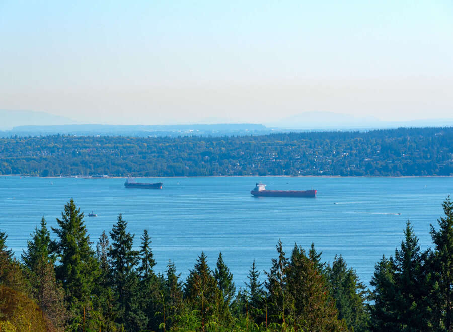 Enjoy breathtaking views of the water and surrounding landscape from this stunning property.