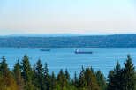 Enjoy breathtaking views of the water and surrounding landscape from this stunning property.
