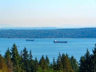 Enjoy breathtaking views of the water and surrounding landscape from this stunning property.