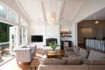 This stunning living room boasts a bright and airy atmosphere, perfect for relaxation and entertaining.