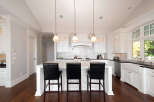 Step into this stunning kitchen, showcasing a bright and airy design with white cabinetry and a spacious island.