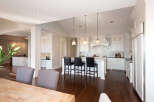 This stunning kitchen boasts a bright and airy design, perfect for both cooking and entertaining.