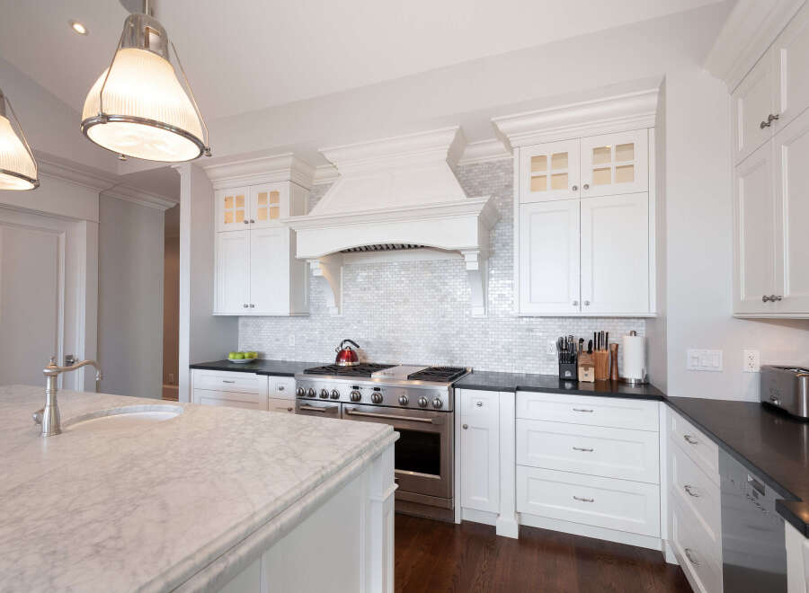 This stunning kitchen boasts a modern design with high-end appliances and finishes.