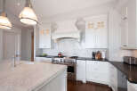 This stunning kitchen boasts a modern design with high-end appliances and finishes.