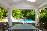 Enjoy the ultimate in outdoor living with this stunning property featuring a private pool and lush landscaping.