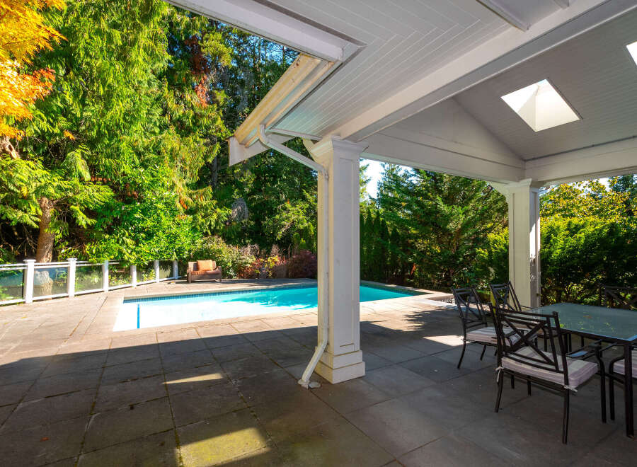 Enjoy outdoor living at its finest with this stunning property featuring a private pool and a covered patio.