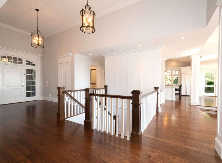 Step into luxury with this stunning home featuring a grand entrance and exquisite hardwood floors.