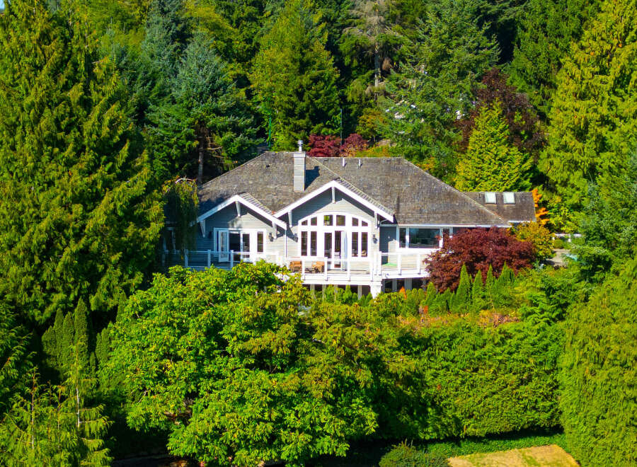 Nestled amidst lush greenery, this stunning property offers a serene escape.