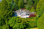 Nestled amidst lush greenery, this stunning property offers a serene escape.