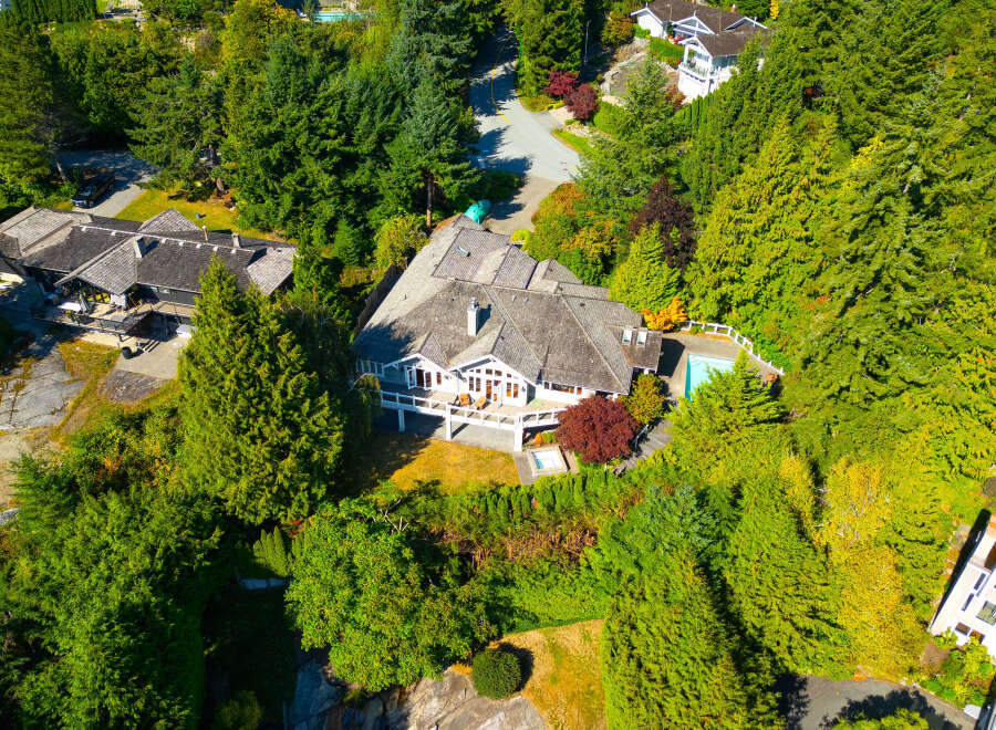 This stunning property boasts a luxurious home nestled amidst lush greenery.