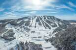 Experience the ultimate winter getaway with this stunning ski resort property! Nestled amidst a picturesque landscape, this property boasts a prime location with direct access to multiple ski slopes.