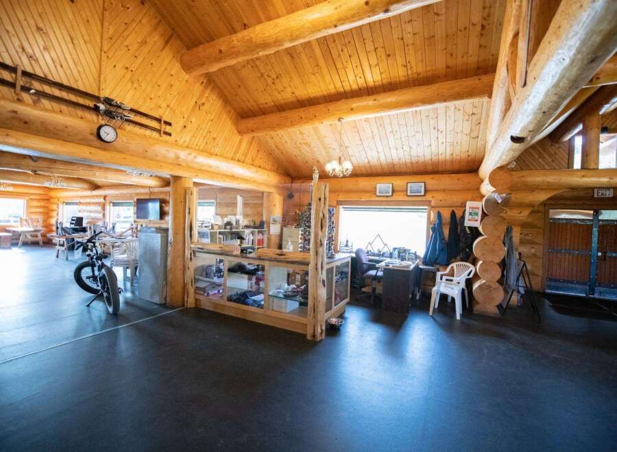 Step into this stunning log cabin, showcasing a warm and inviting interior.