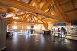 Step into a charming log cabin cafe, perfect for a cozy retreat.