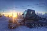 Experience the tranquility of winter in this stunning property! This image showcases a snow groomer preparing the slopes, promising pristine conditions for your next adventure.