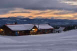 Nestled in a winter wonderland, this charming property offers a cozy retreat with stunning mountain views.