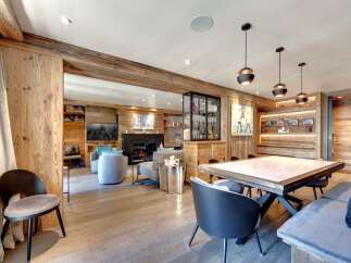 Experience luxury living in this stunning property, featuring exquisite wooden accents and a cozy fireplace.